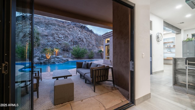 view of patio featuring visible vents and an outdoor pool