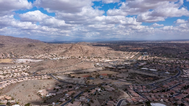 aerial view featuring a mountain view and a desert view