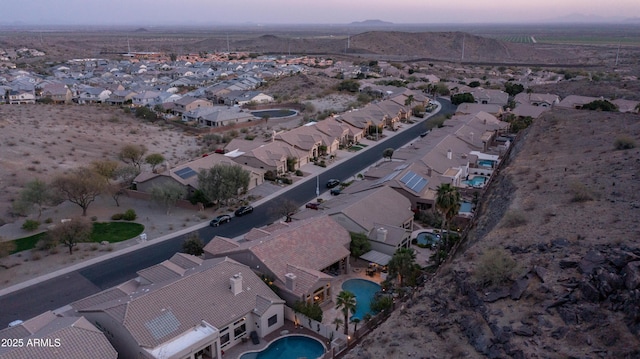 birds eye view of property with a residential view