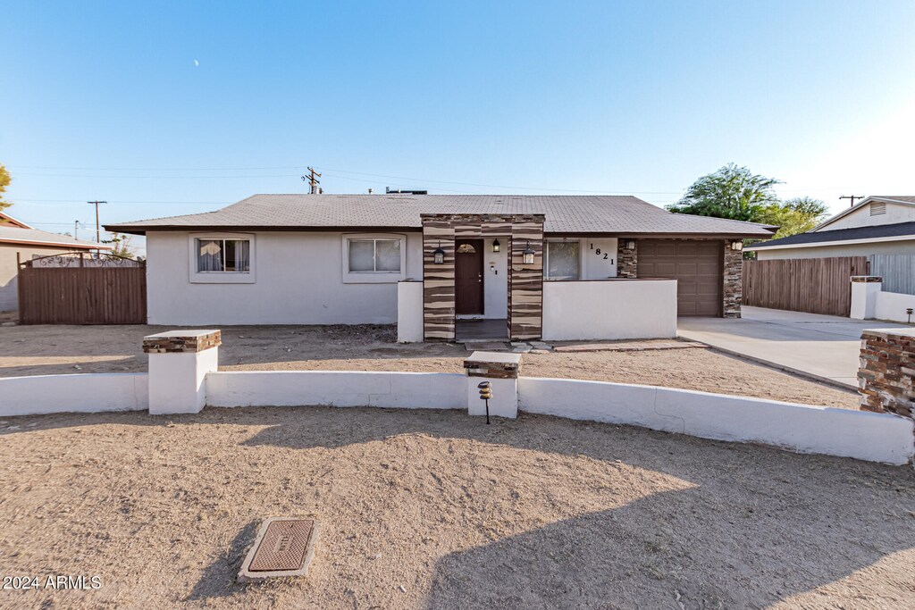 ranch-style home featuring a garage