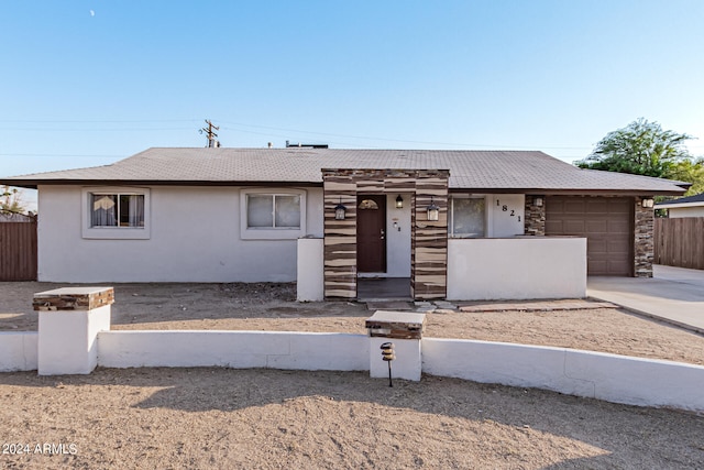 ranch-style house featuring a garage