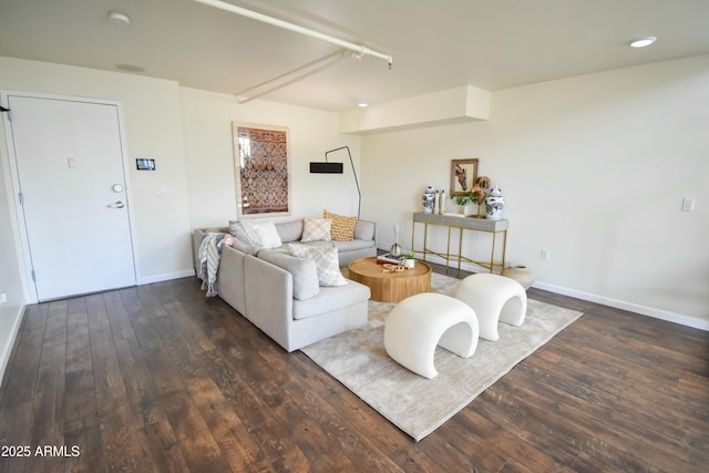 living room with dark hardwood / wood-style flooring