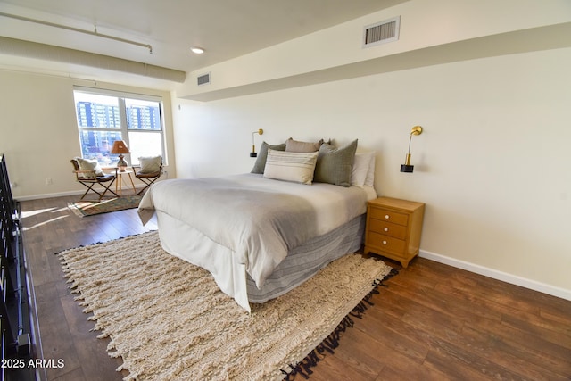 bedroom featuring dark wood-type flooring