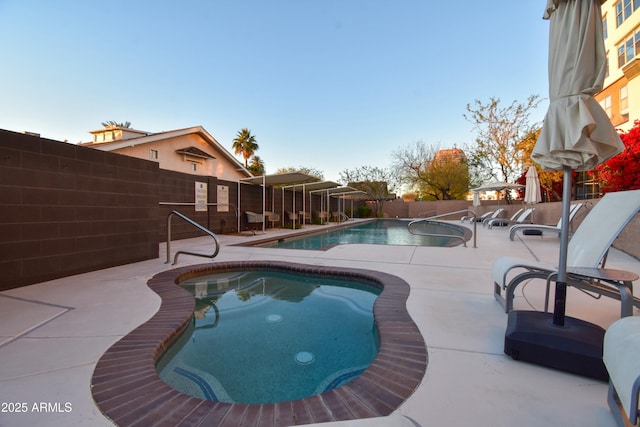 view of swimming pool with a patio area