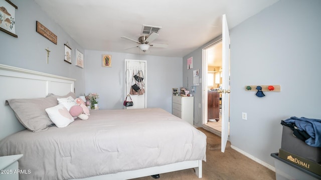 bedroom featuring ceiling fan and carpet