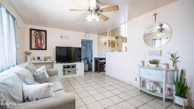 living room featuring light tile patterned flooring and ceiling fan