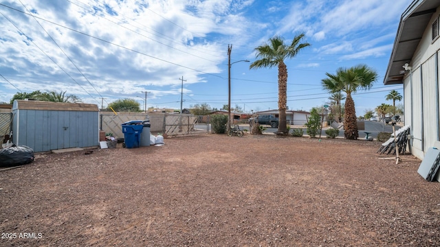 view of yard with a storage unit