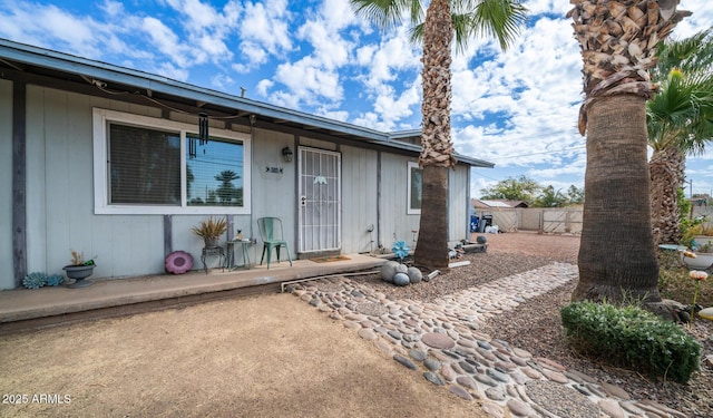 entrance to property with a patio area