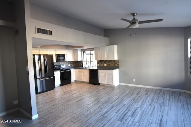 kitchen featuring white cabinetry, black appliances, tasteful backsplash, and light wood-type flooring