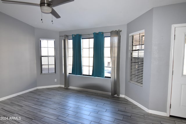 empty room featuring hardwood / wood-style floors and ceiling fan