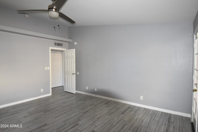 empty room featuring hardwood / wood-style flooring and ceiling fan