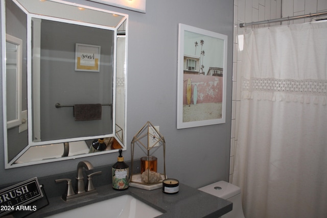 bathroom with vanity and toilet