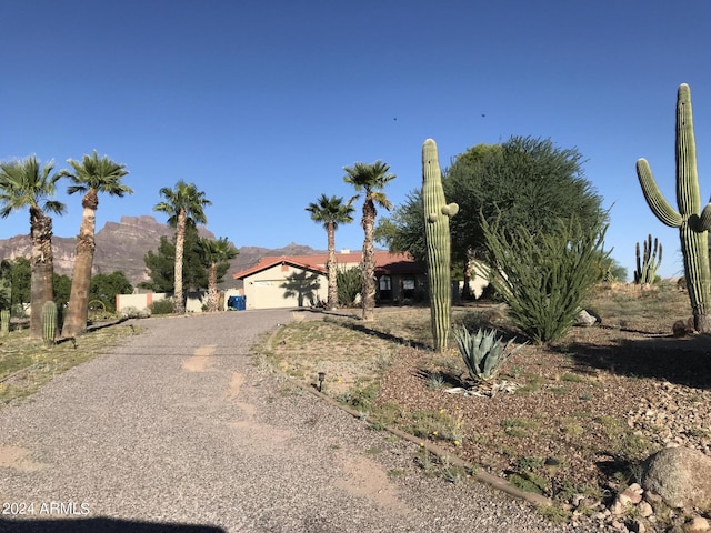 view of front of home with a mountain view and a garage