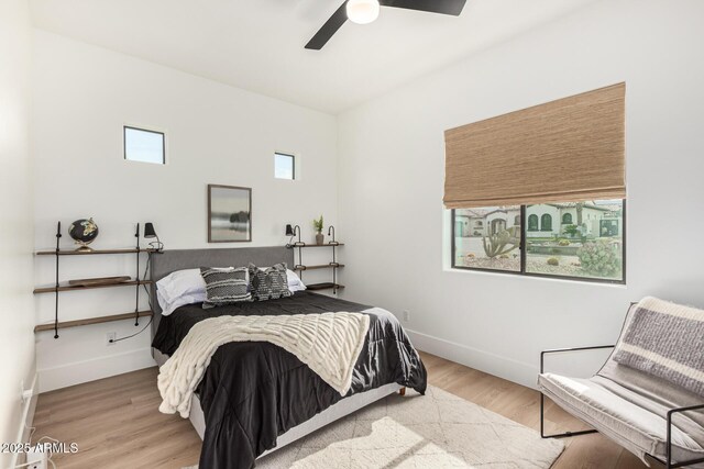 bedroom featuring ceiling fan and wood-type flooring