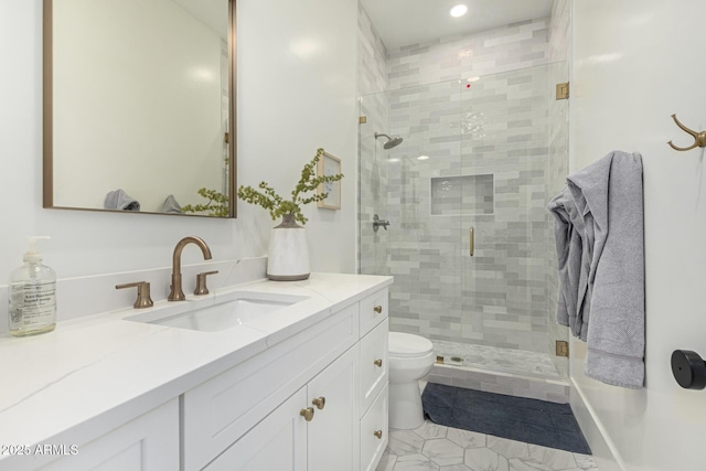 bathroom featuring tile patterned flooring, vanity, toilet, and an enclosed shower