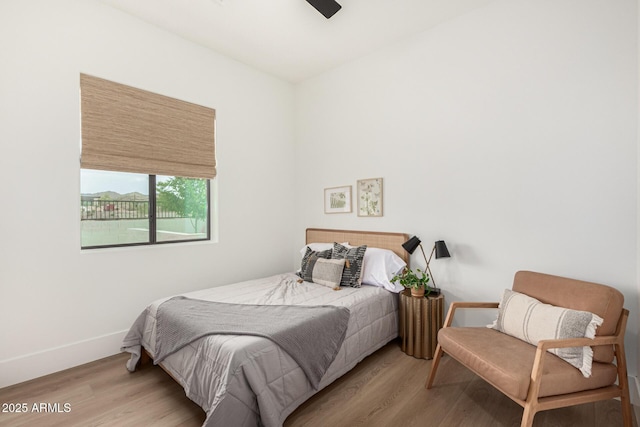 bedroom featuring ceiling fan and light wood-type flooring