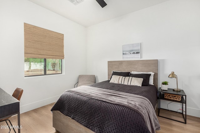 bedroom featuring light wood-type flooring and ceiling fan