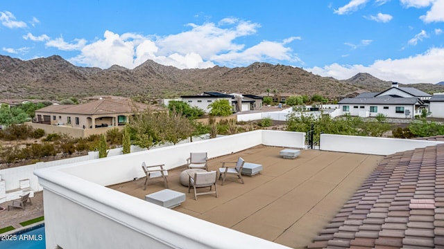 view of patio / terrace featuring a mountain view and a balcony