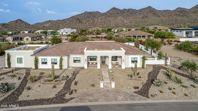 view of front of property with a mountain view