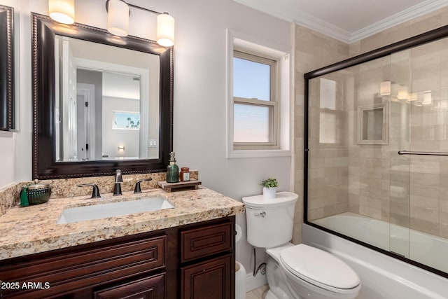 8807 E Dahlia Dr, Scottsdale, AZ 85260 - full bathroom featuring vanity, crown molding, toilet, and combined bath / shower with glass door