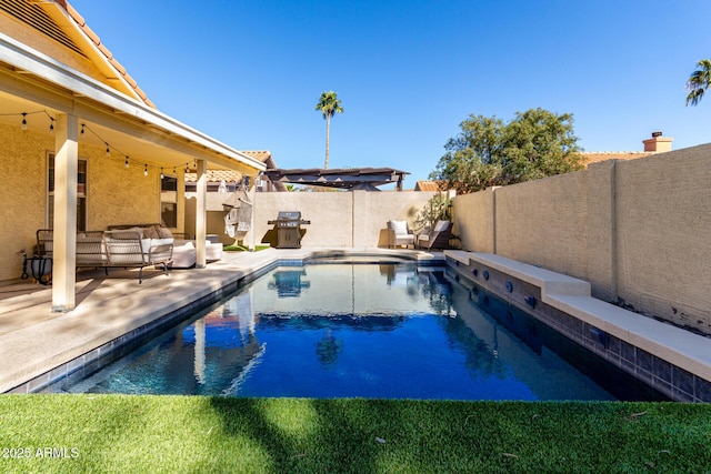 8807 E Dahlia Dr, Scottsdale, AZ 85260 - view of pool with a fenced in pool, area for grilling, a fenced backyard, and a patio area