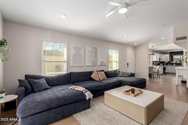 8807 E Dahlia Dr, Scottsdale, AZ 85260 - living room featuring recessed lighting, visible vents, light wood-style flooring, and ceiling fan