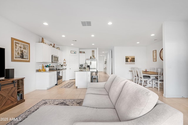 living room featuring light tile patterned flooring