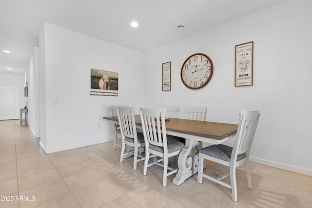 dining area with light tile patterned floors