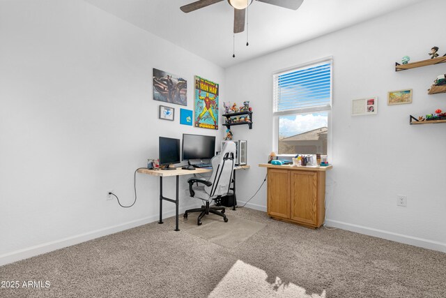 carpeted home office with ceiling fan