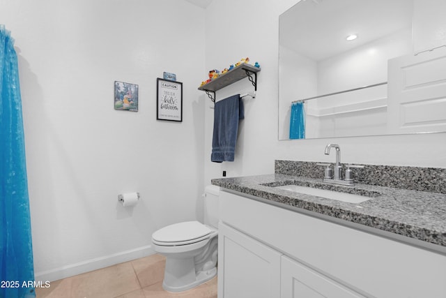 bathroom with vanity, tile patterned floors, toilet, and walk in shower