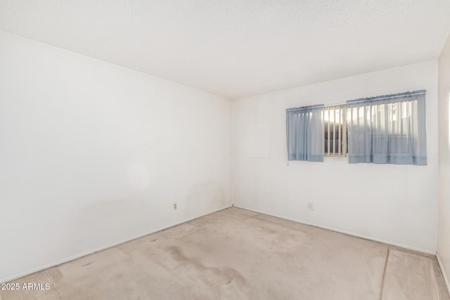 unfurnished room featuring carpet floors