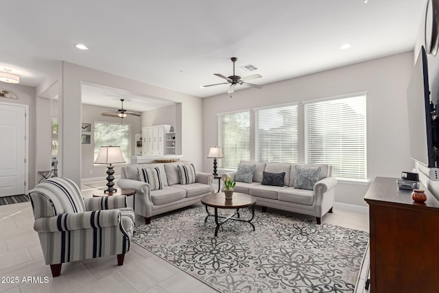 tiled living room featuring plenty of natural light