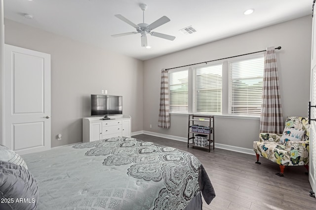 bedroom with ceiling fan and hardwood / wood-style floors