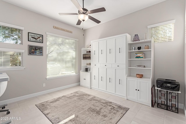 interior space with ceiling fan and light tile patterned floors