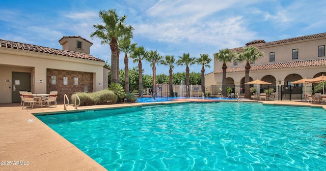 view of swimming pool featuring a patio area