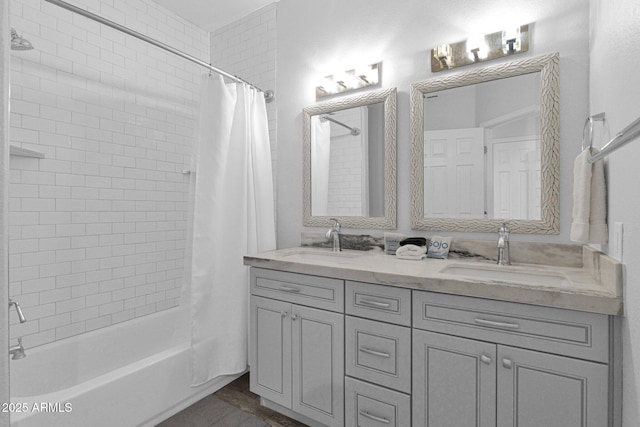 bathroom featuring shower / bath combo and vanity