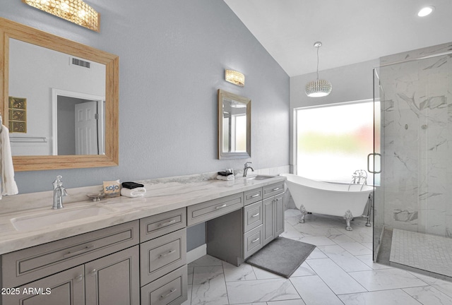 bathroom featuring vanity, independent shower and bath, and lofted ceiling