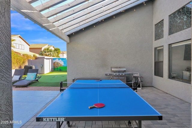 view of patio with a pergola and grilling area