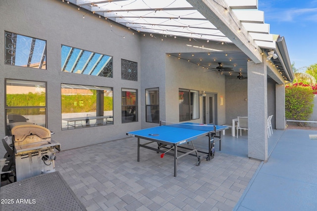 view of patio featuring ceiling fan