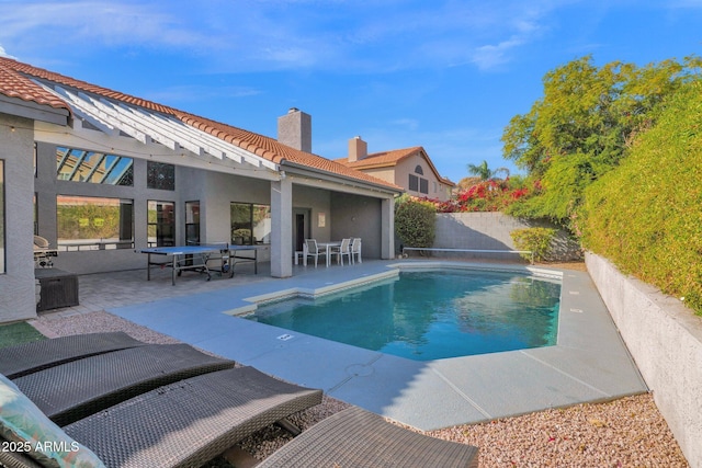 view of pool featuring a patio