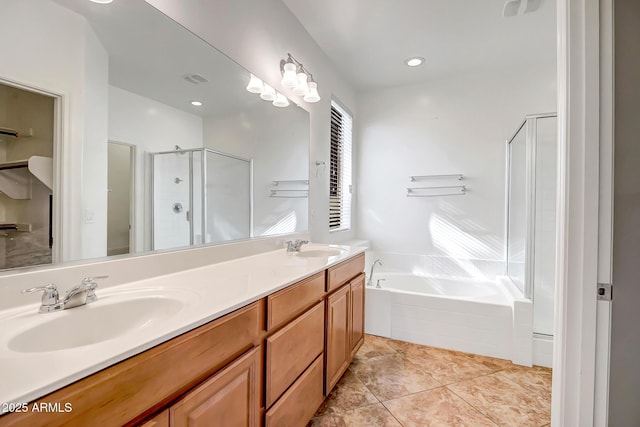 full bathroom featuring double vanity, a garden tub, a shower stall, and a sink