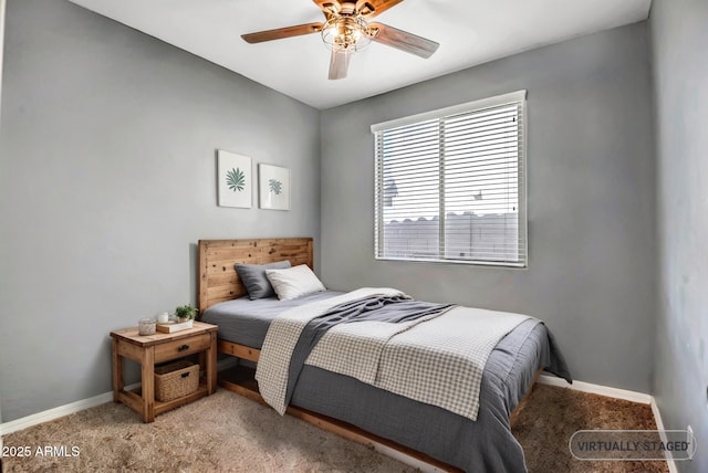 bedroom with light carpet, ceiling fan, and baseboards