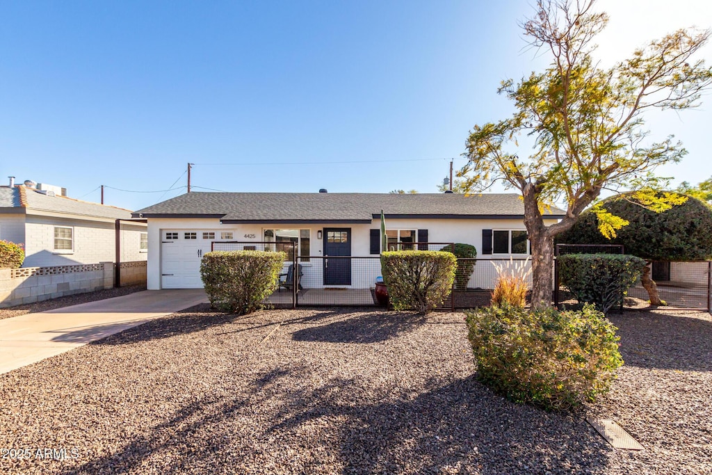 single story home featuring a garage