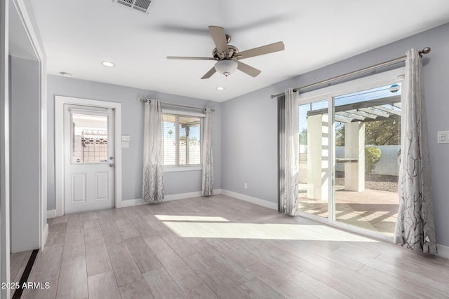 unfurnished room featuring ceiling fan and light wood-type flooring