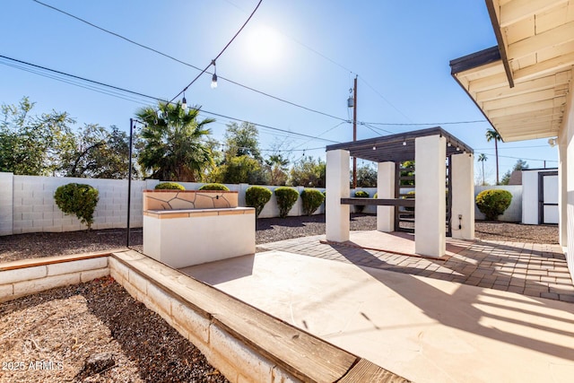 view of patio / terrace with a gazebo and a storage unit