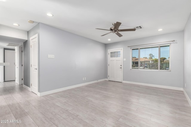 unfurnished room with ceiling fan and light hardwood / wood-style flooring