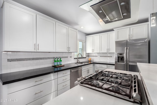 kitchen featuring white cabinetry, sink, and appliances with stainless steel finishes