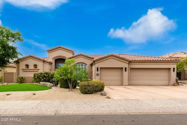 mediterranean / spanish-style home with a garage