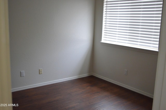 6620 W Shaw Butte Dr, Glendale, AZ 85304 - unfurnished room featuring dark wood-type flooring and baseboards