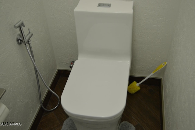 6620 W Shaw Butte Dr, Glendale, AZ 85304 - bathroom view of a textured wall, toilet, and baseboards